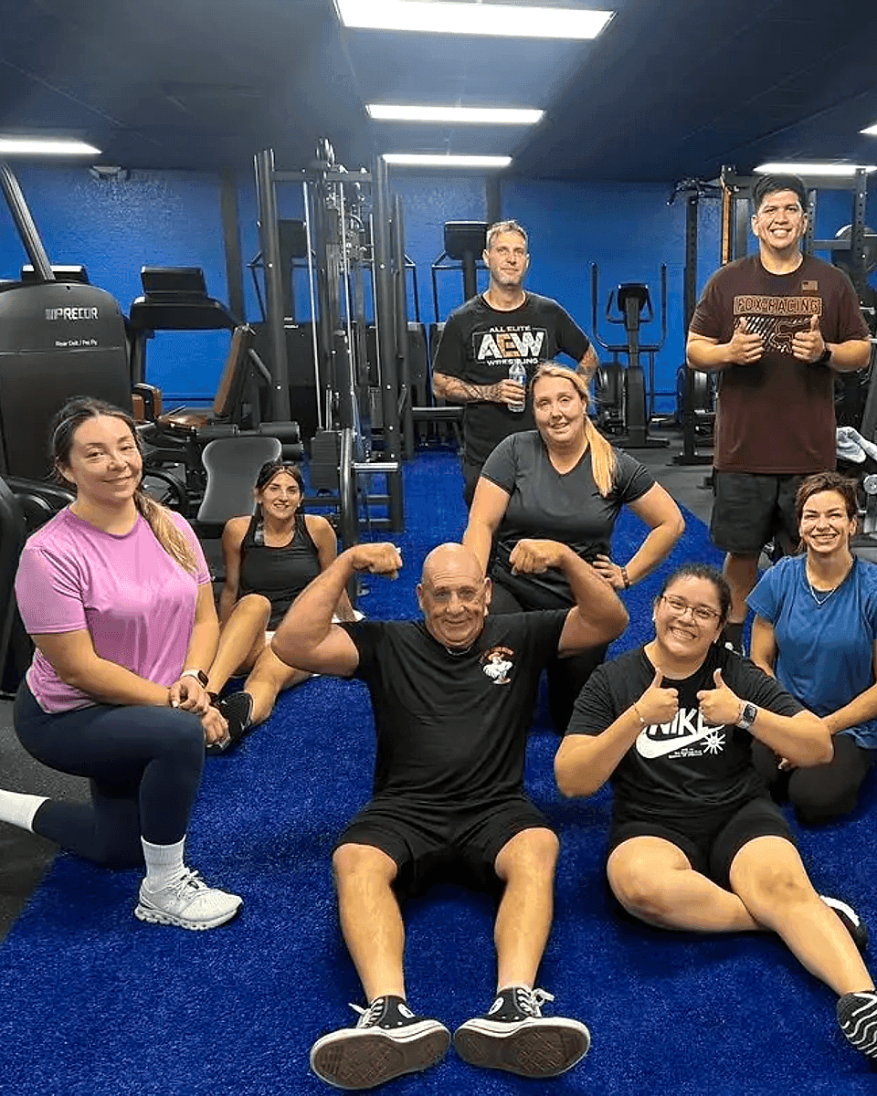 A bootcamp class at Live Well Fitness Center in Fort Pierce, members gathered on the gym floor after a session